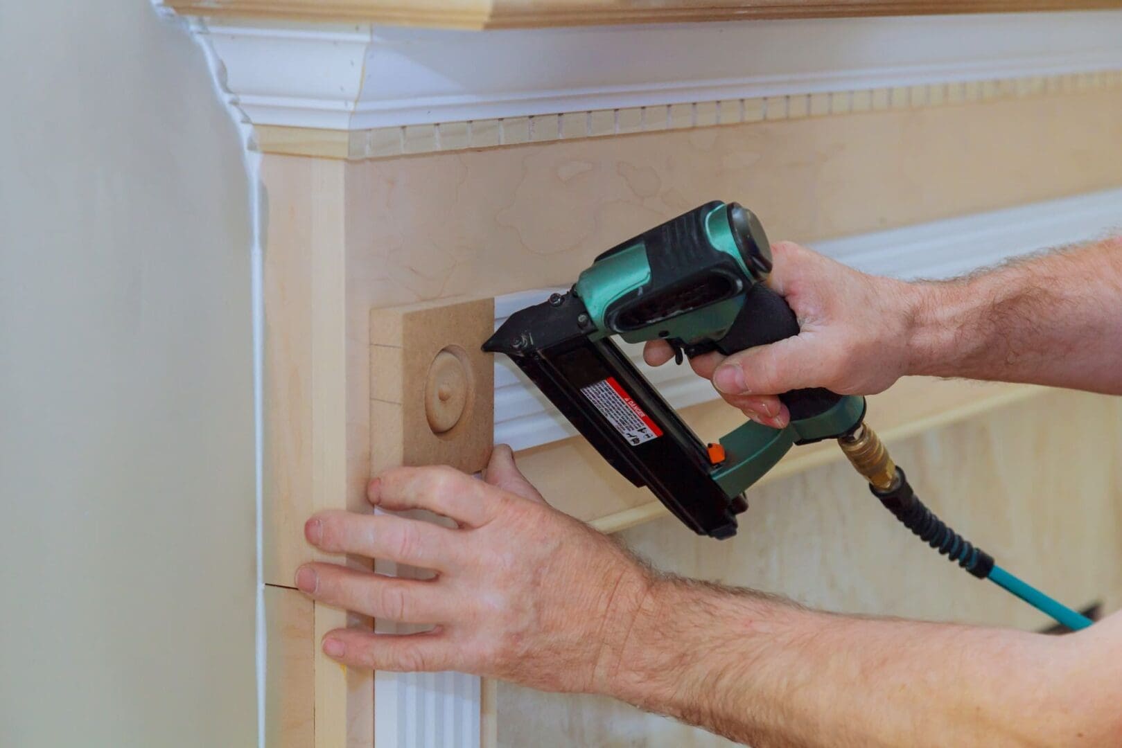 Fireplace with installation of moldings on fireplaces and white crown molding, no fire