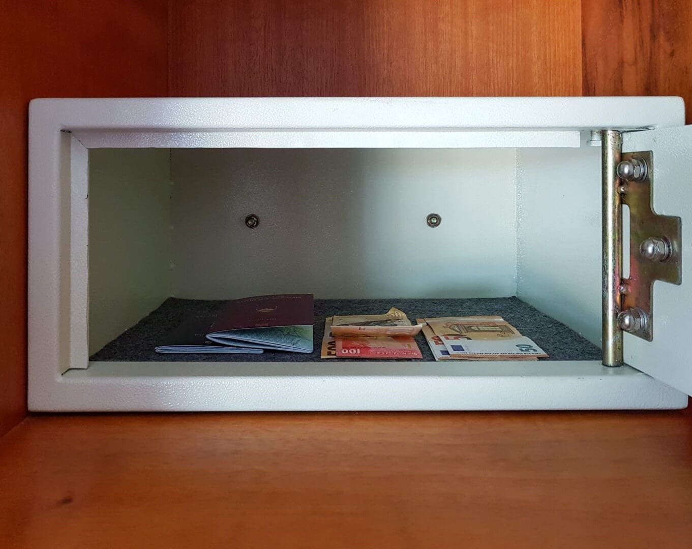 Opened safe with money, cash and passports.